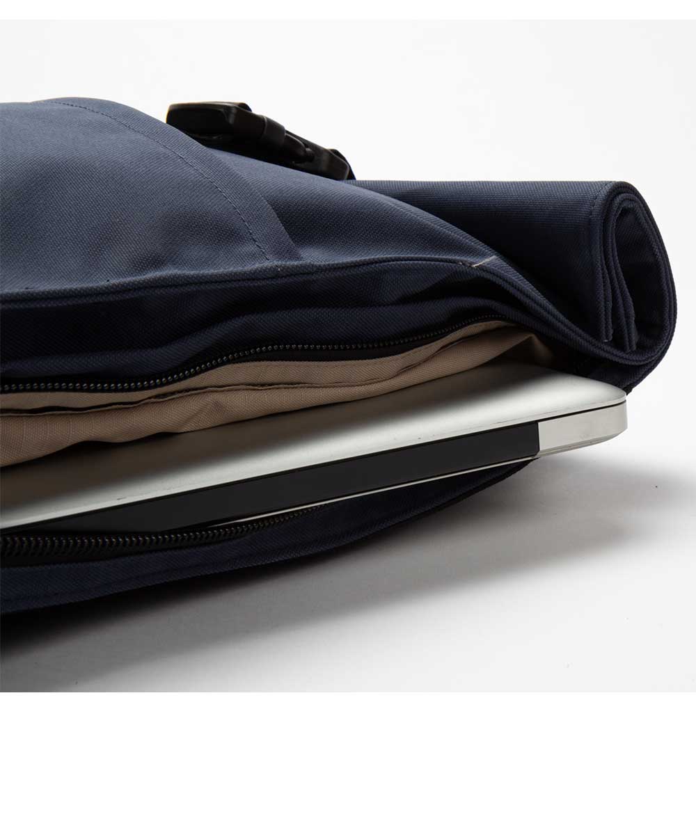 Property of Max reflective roll top backpack
