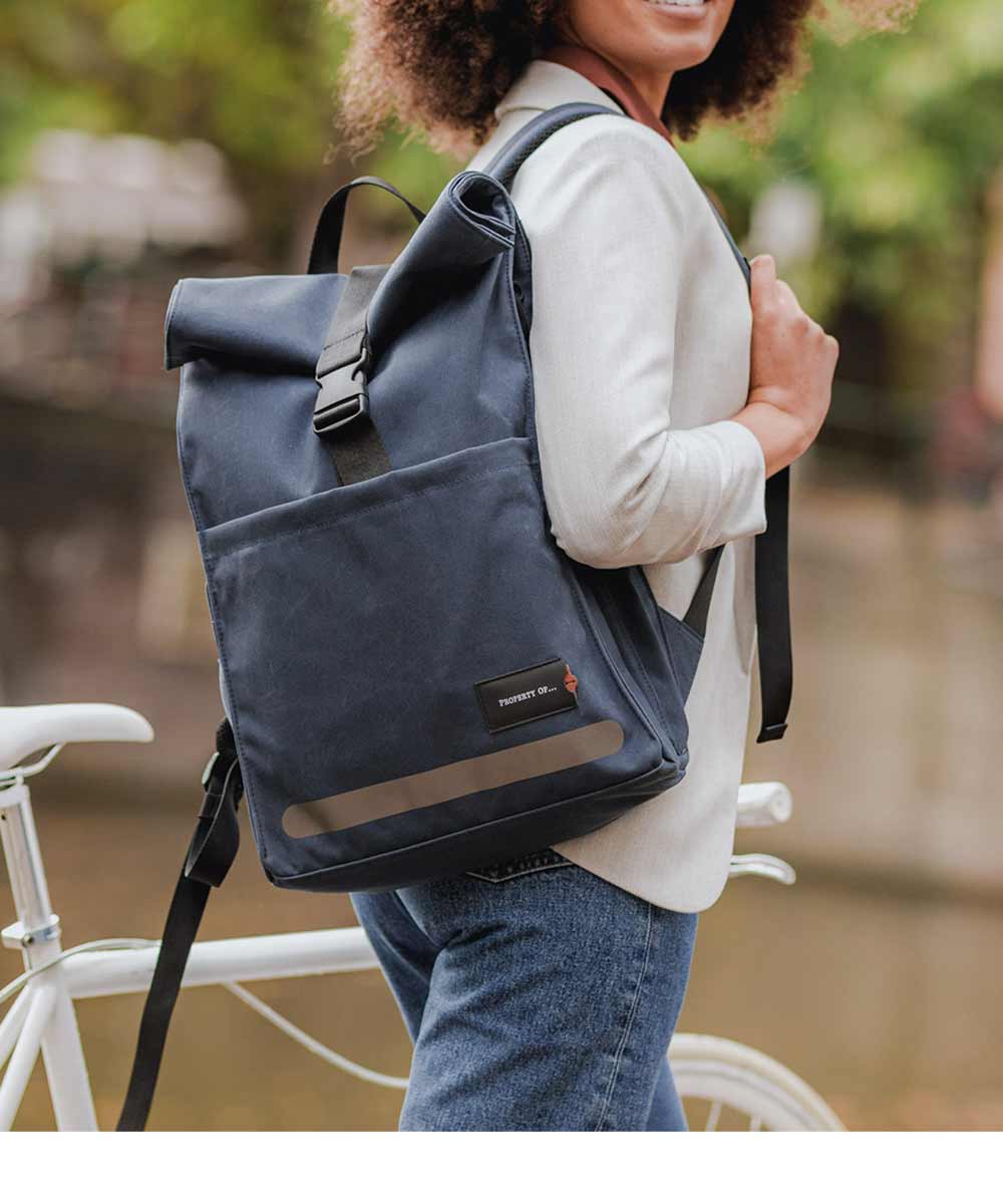 Property of Max reflective roll top backpack